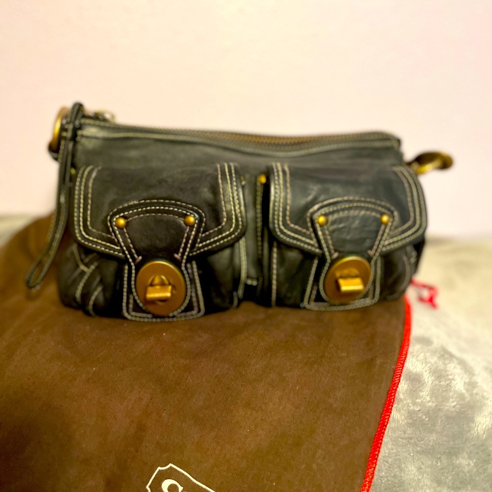 Coach black leather shoulder bag with gold hardware.